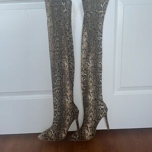 Thigh high snakeskin look boots